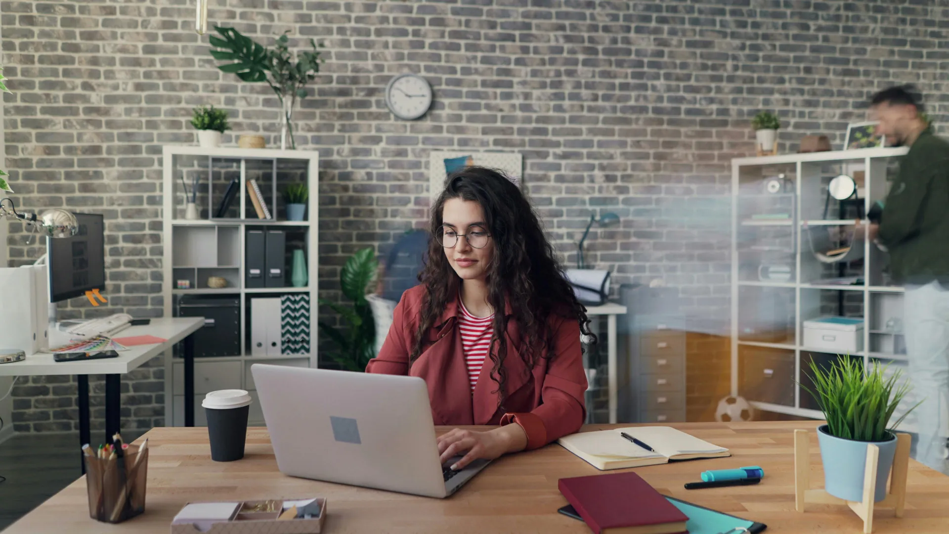 A funding specialist reviewing an application in a warm office